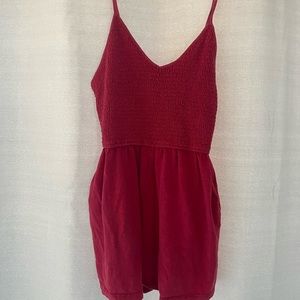 Pink romper with pockets. Perfect as a swim suit cover or to wear casually